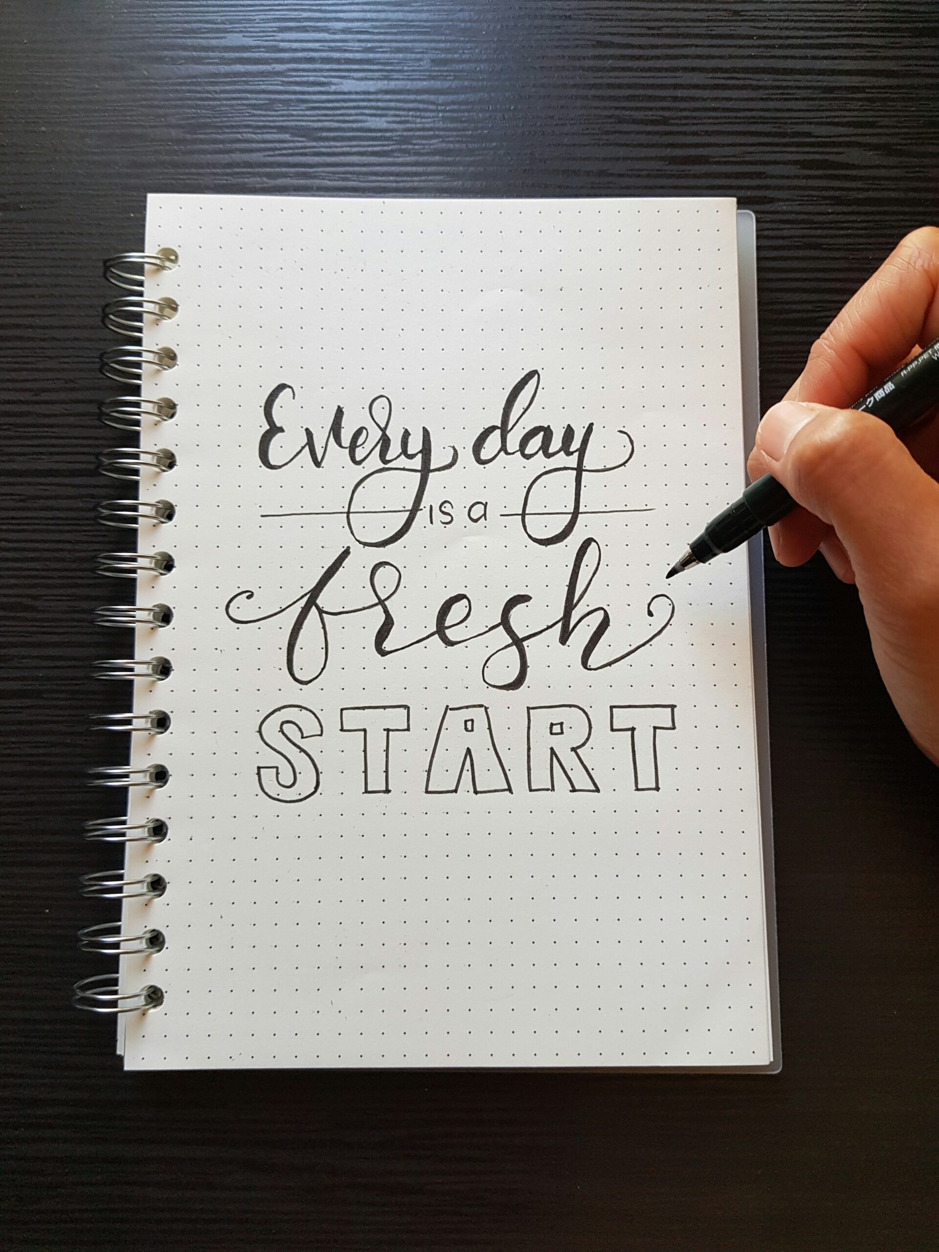 Notebook that says "Every day is a fresh start."